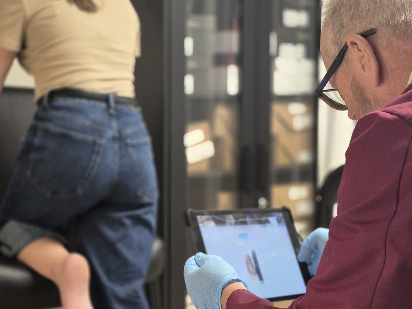 Steve capturing a 3D scan of a patient’s foot on a tablet
