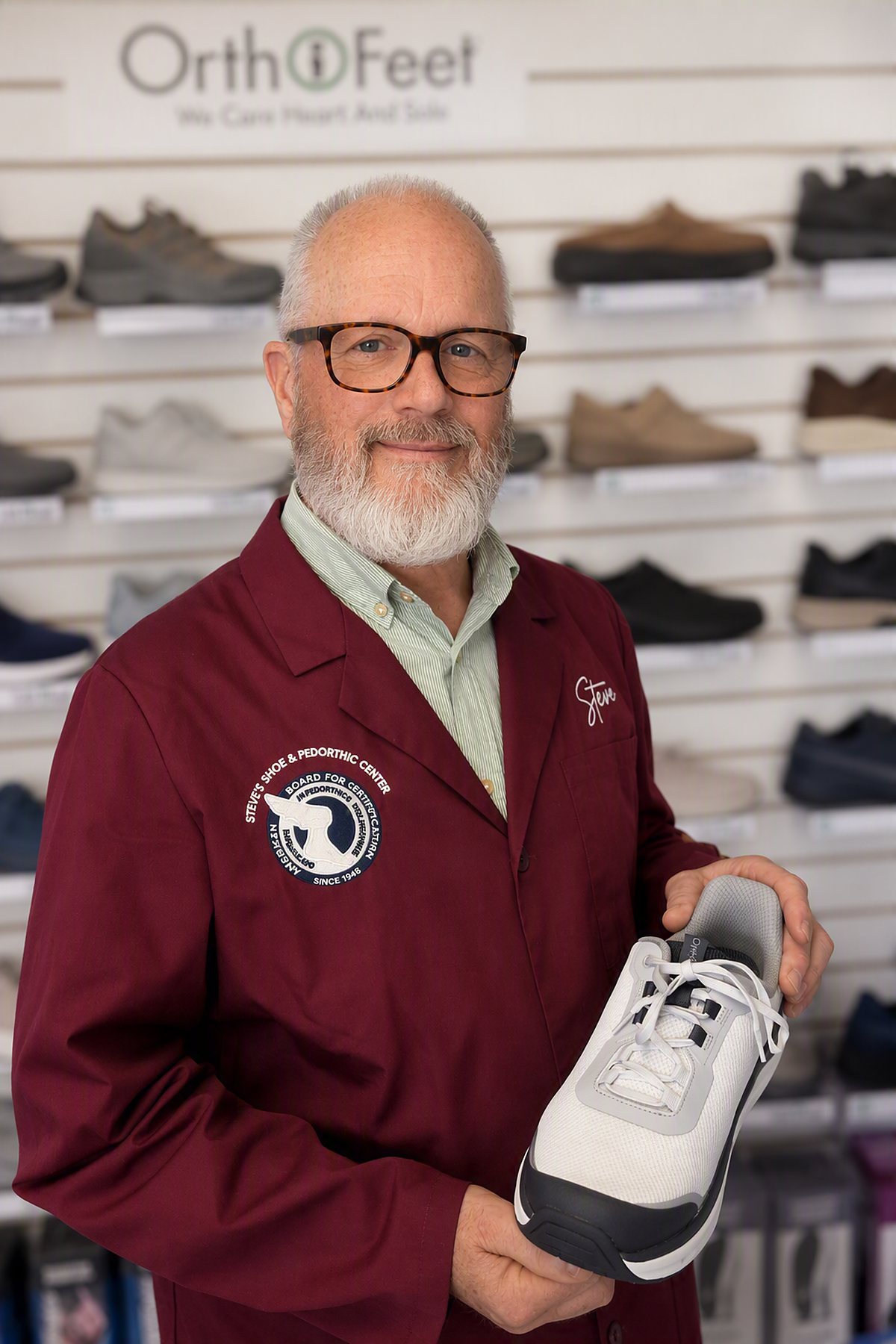 Steve holding an Orthofeet therapeutic shoe in the fitting room