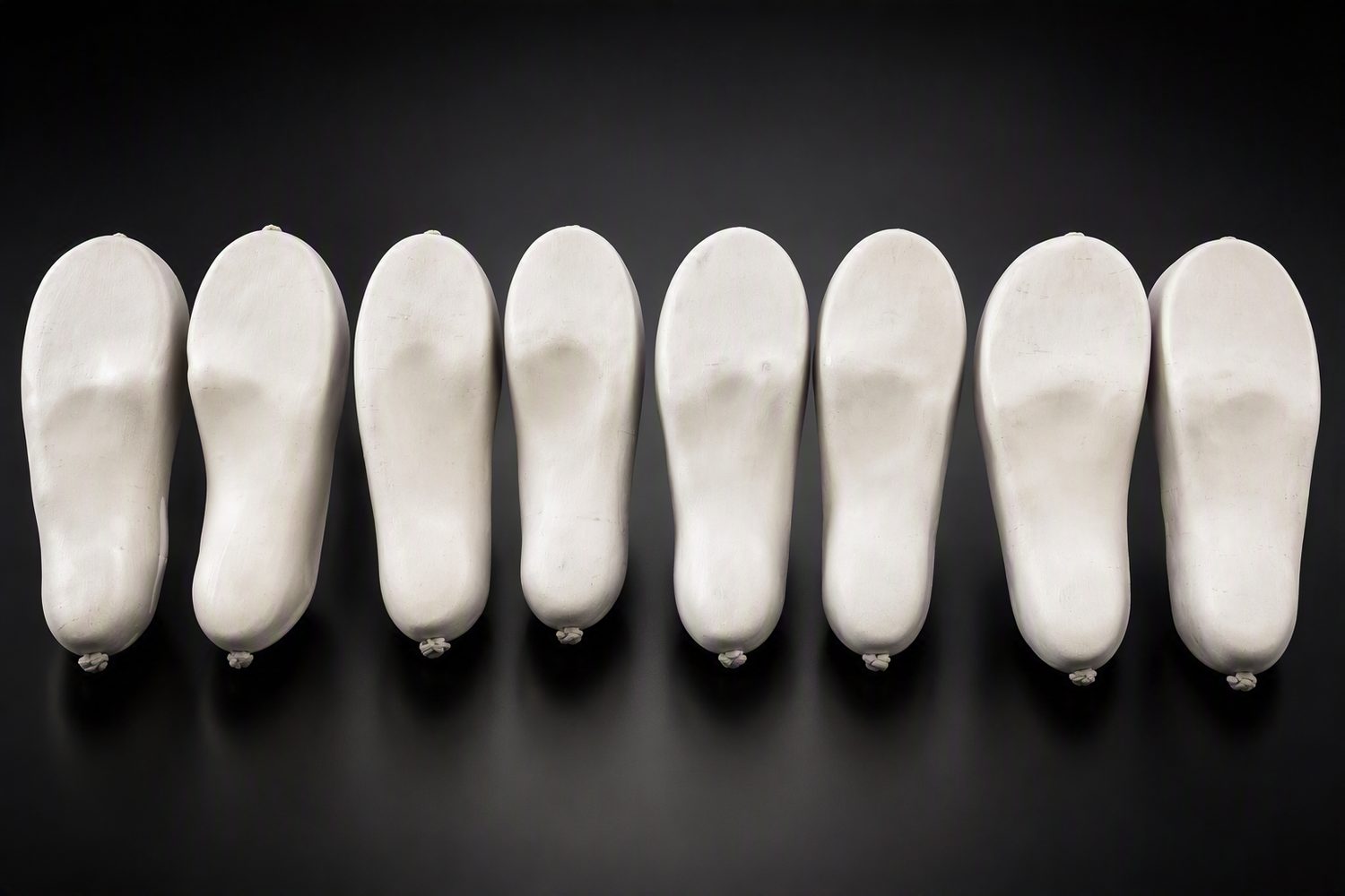 A row of plaster casts taken from foam impressions
